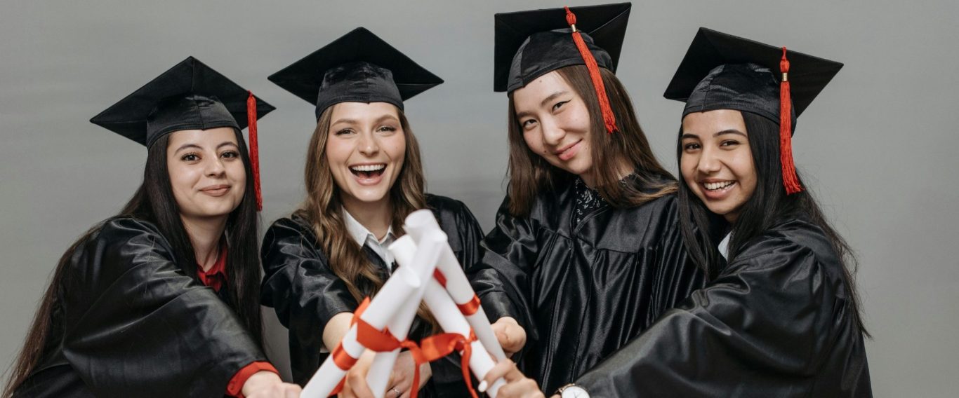 Mar Education graduated students! Our UK graduated students joyfully holding diplomas together.